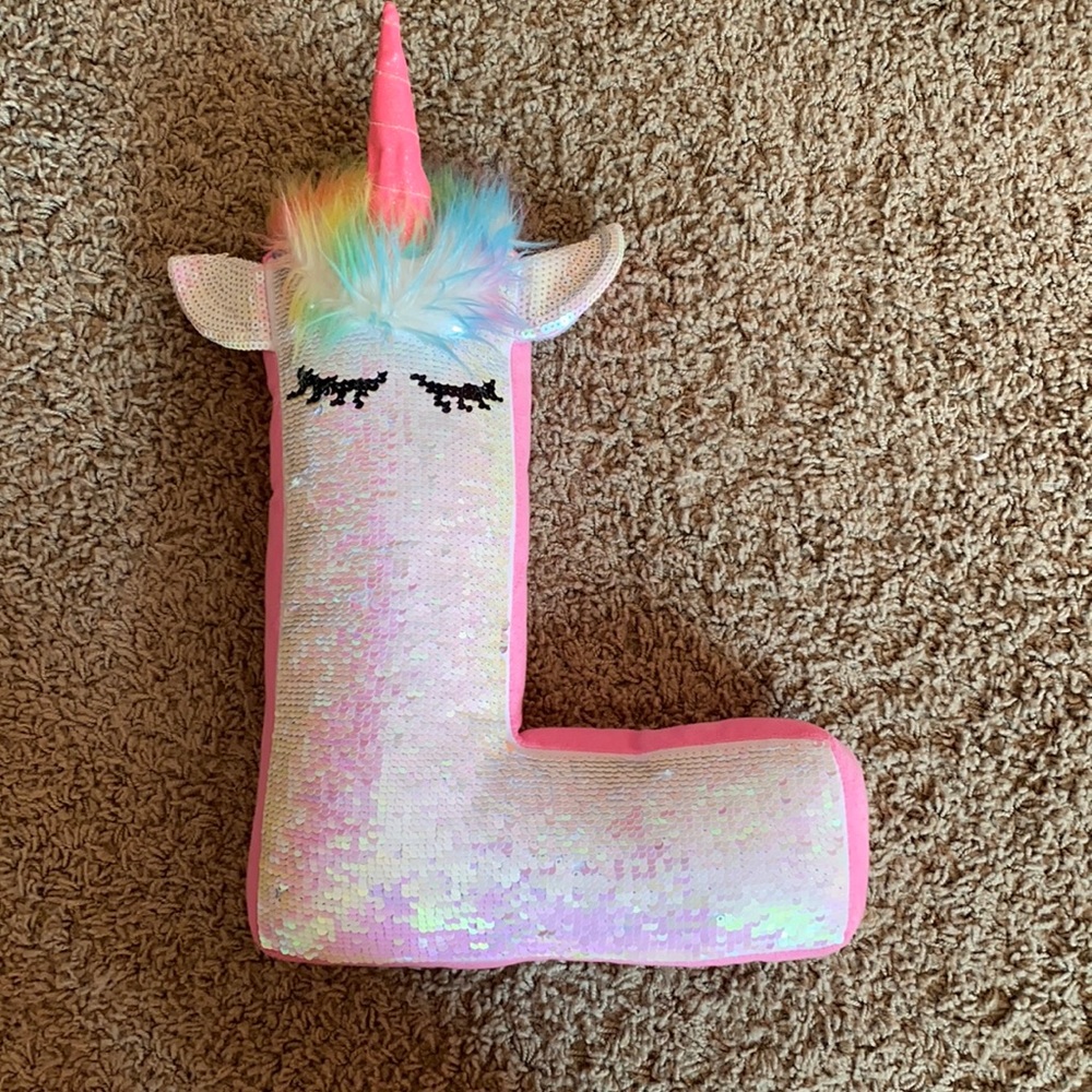 Justice “L” flip pillow.